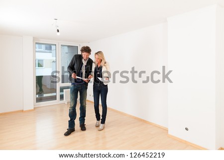 Real estate market - young couple looking for real estate to rent or buy an apartment