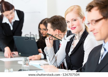 Business - businesspeople have a meeting or workshop with presentation in office
