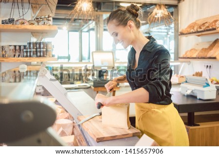 Similar – Image, Stock Photo Smiling woman cutting cheese for salad in kitchen