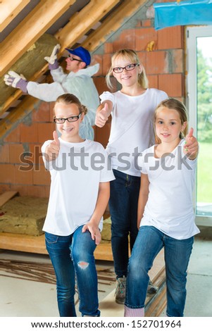 Engineer or father with daughters or daughter with friends building the roof with insulating material