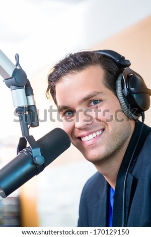 Presenter or host in radio station hosting show for radio live in Studio