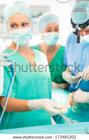 doctor surgery team in operating room or operation theter of hospital working in emergency situation