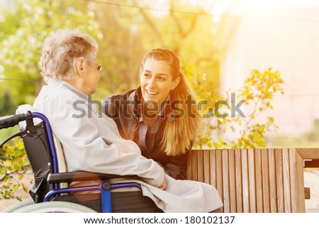 Image, Stock Photo Woman visiting her grandmother in isolation during a coronavirus pandemic