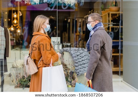 Similar – Foto Bild Covid-19 Pandemie Schaufenster eines zeitweise geschlossenen Geschäfts mit Hinweisschild in Französisch Schaufensterpuppe und Flasche mit Handdesinfektionsmittel