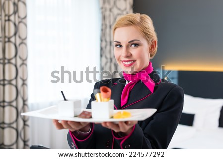 Room service serving sweet VIP dessert in design hotel on room