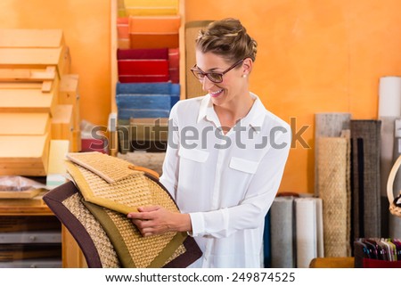 Interior Designer buying floor mats in home improvement store