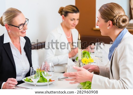 Businesswomen meeting at business dinner or lunch in Restaurant