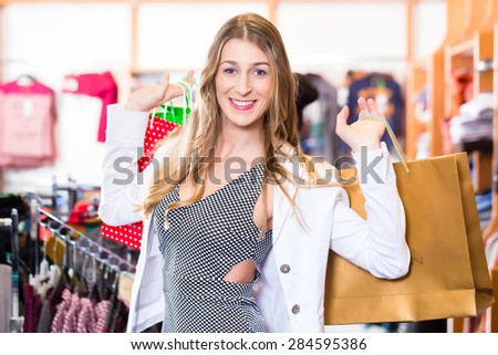 Woman shopping in fashion shop or shop