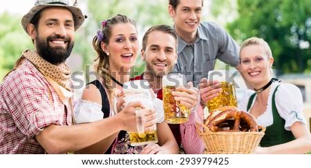 Friends in Bavarian beer garden drinking in summer ストックフォト © 
