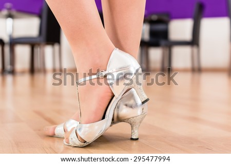 Women with her dancing shoes in dance school