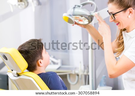 Dentist giving patient advice in dental surgery
