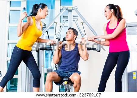 Women fighting over man at gym