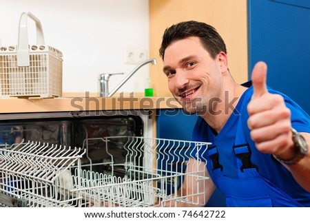 Technician or plumber repairing the dishwasher in a household