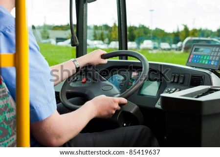 Bus driver sitting in his bus on tour