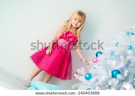 beautiful girl dress up Christmas tree