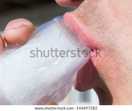 a large piece of ice mouth, man