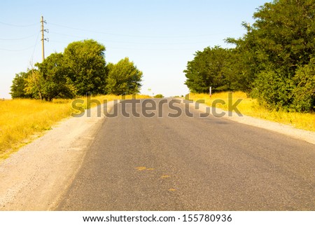 The road between the town and village in Kazakhstan