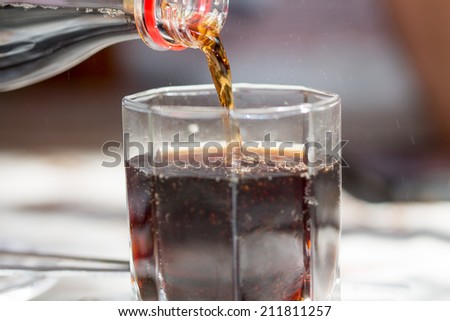 pouring dark drink