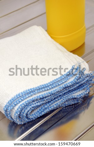 Dish washing cloths on a stainless steel drainer