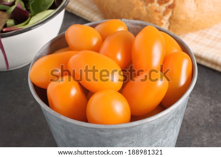 Orange Santa F1 grape tomatoes a hybrid variation of the more usual red tomato.