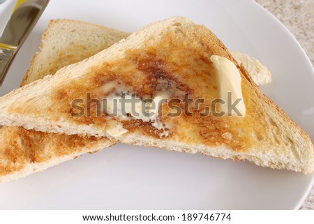 White bread toast with melting butter