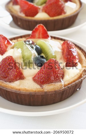 Fruit tarts made with sweet pastry creme patissiere and fruit