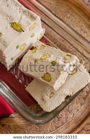 Halvah or Halva a sweet confection made from tahini sesame paste and pistachio nuts popular throughout the Middle East