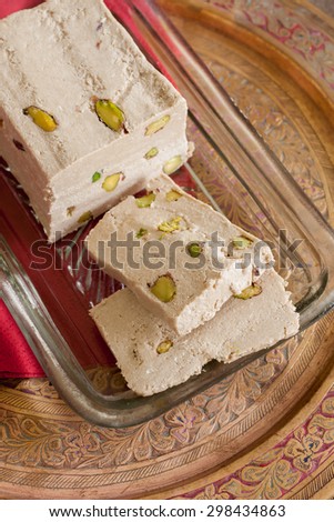 Halvah or Halva a sweet confection made with tahini sesame paste and pistachio nuts popular throughout the Middle East