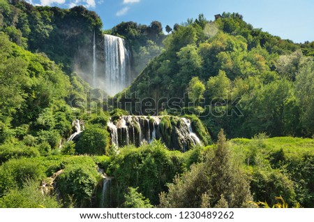 The Cascata delle Marmore (Marmore Falls) is a man-made waterfall created by the ancient Romans located near Terni in Umbria region, Italy. The waters are used to fuel an hydroelectric power plant Foto stock © 