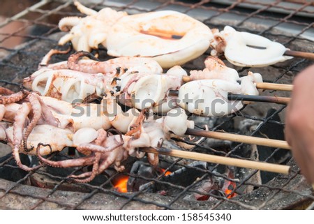 Fast food is grilled squid that ate itself. The family feasting. A party with friends. A small casual party.