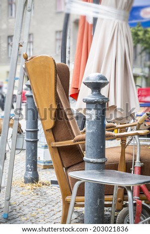 old arm chair and stuff on a flea market.