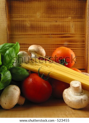 Warm still life of pasta and the need ingredients to cook a delicious meal!