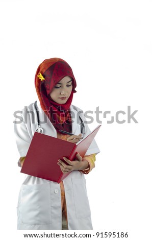 beautiful muslim medical doctor woman writing on note book isolated on white background
