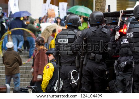 PORTLAND, OREGON - NOV 17: Police in Riot Gear on Vehicle in Downtown Portland, Oregon during a Occupy Portland protest on the first anniversary of Occupy Wall Street November 17, 2011
