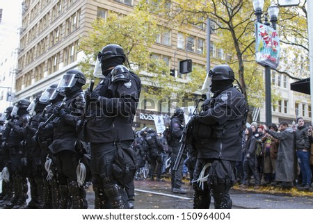 PORTLAND, OREGON - NOV 17: Police Sheriff in Riot Gear Frontline in Downtown Portland, Oregon during a Occupy Portland protest on the first anniversary of Occupy Wall Street November 17, 2011