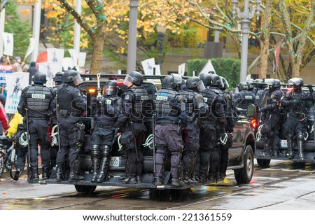 PORTLAND, OREGON - NOVEMBER 17, 2011: Police in Riot Gears on Vehicles in Downtown Portland, Oregon during a Occupy Portland Protest Against Banks on the first anniversary of Occupy Wall Street