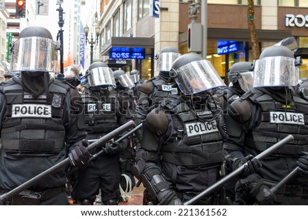 PORTLAND, OREGON - NOVEMBER 17, 2011: Portland Police in Riot Gear in Downtown Portland, Oregon Street during a Occupy Portland Protest Against Banks on the first anniversary of Occupy Wall Street