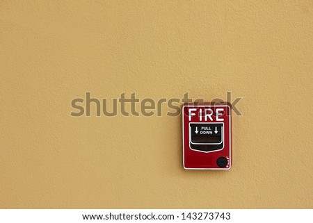 Fire break glass alarm switch  on wall background