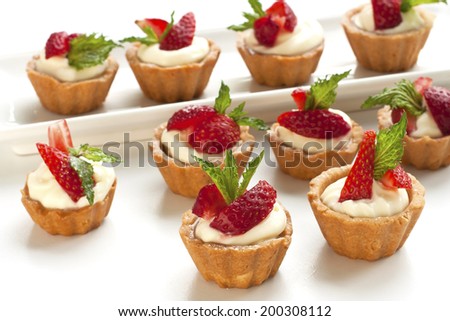 Sweet basket with cream and strawberries