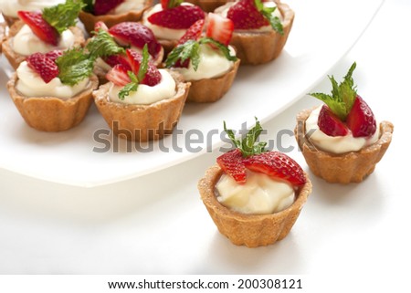 Sweet basket with cream and strawberries