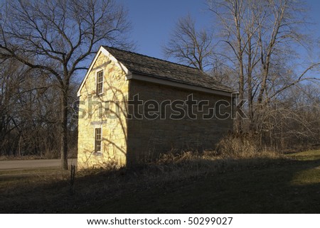 Photo of cold storage and icehouse building next to Sibley House in Mendota Minnesota looking in direction of Minnesota River from southeast corner of building