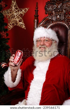 PHOENIX, AZ - DECEMBER 4, 2010: Santa Claus holding a can of Coca-Cola Classic. Coca-Cola is the one of the worlds favorite carbonated beverages.
