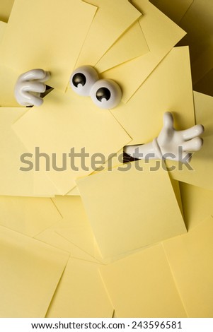 Hands reach out and eyes peer out from under several bright yellow sticky notes.
