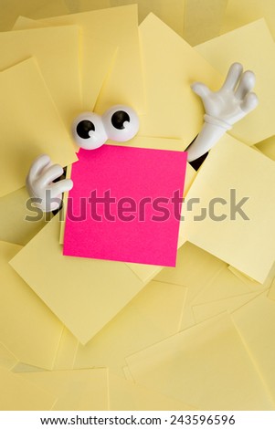 Hands reach out and eyes peer out from under several bright yellow sticky notes and a pink one as well.