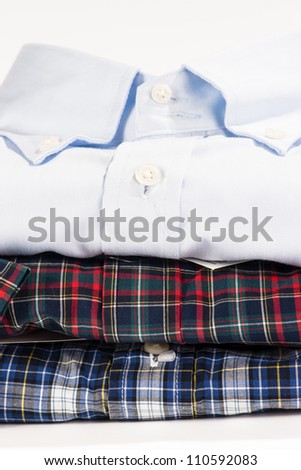 Stack of folded shirts with blank label