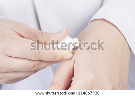 Woman hands holding cosmetic cream tube