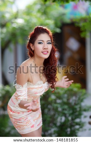 Beautiful young woman stand alone at the outdoor mall, Model is Thai Ethnicity.