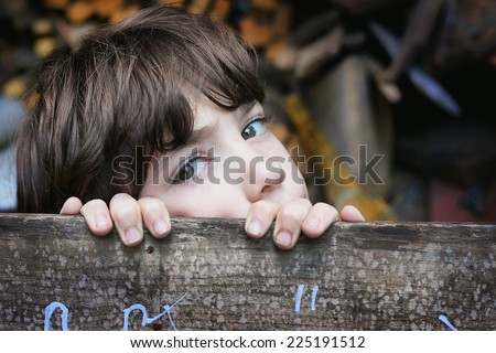 little boy hide  in his secret place