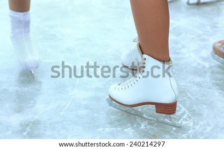 ice skates on legs on the outdoor skating rink
