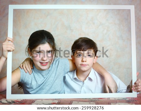 siblings brother and sister cute portrait in frame